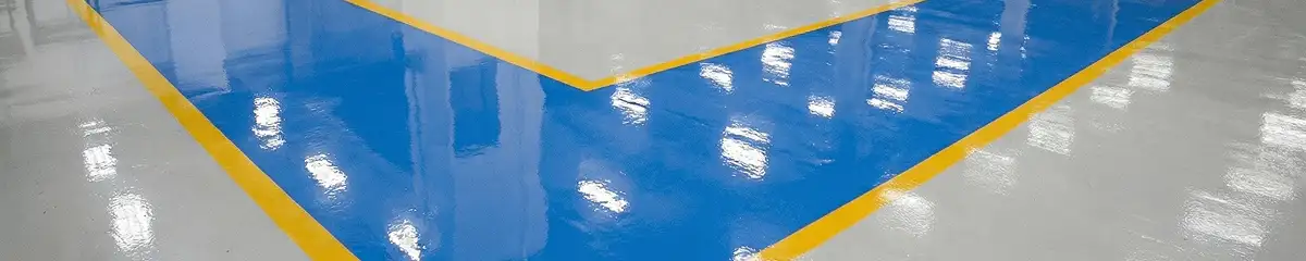 A factory floor professionally covered and marked with epoxy flooring in Bloomington, IN