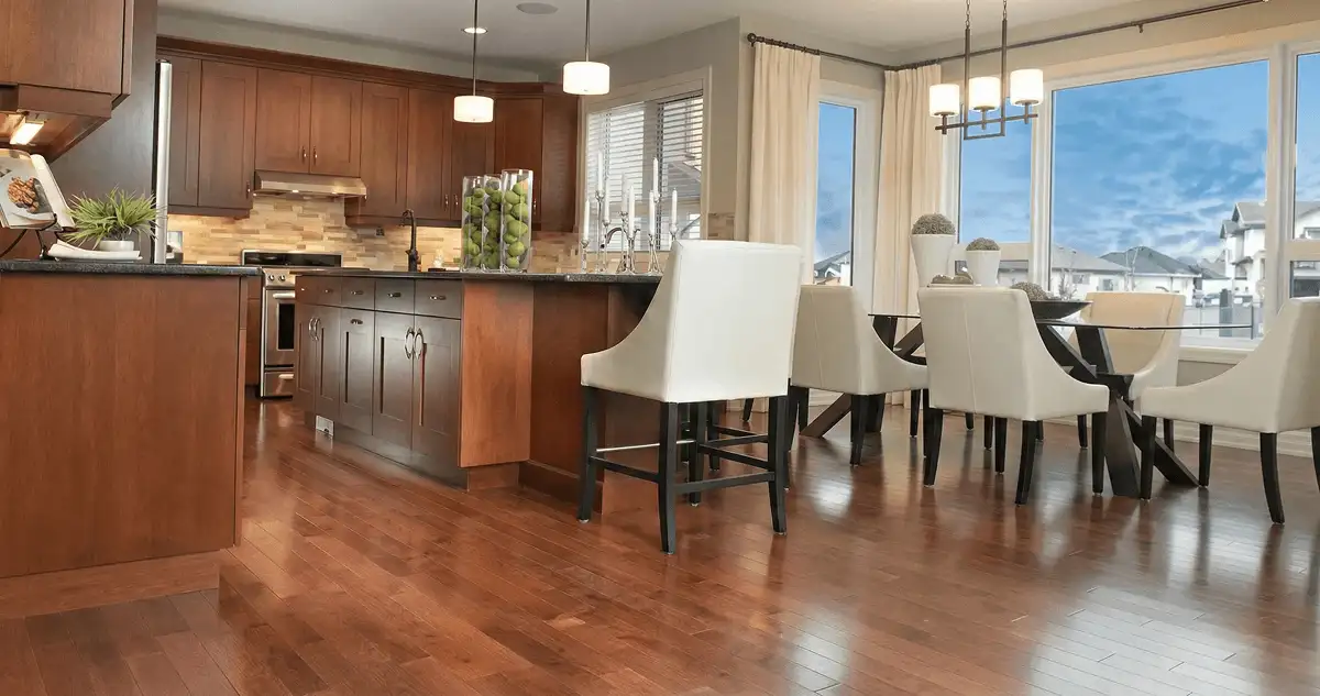 A modern kitchen with professionally installed wood flooring in Bloomington, IN