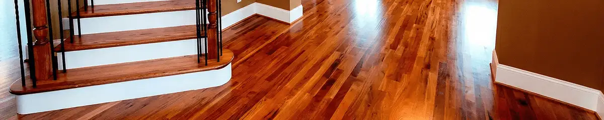 Base floor of a staircase with professionally restored wood flooring in Bloomington IN