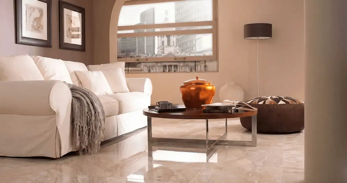 Modern living room with professionally installed marble flooring, a beige sofa, coffee table in Bloomington, IN
