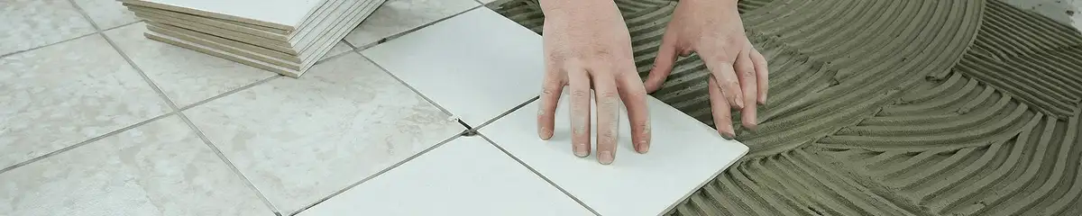 Professional installing white tile floors in Bloomington, IN
