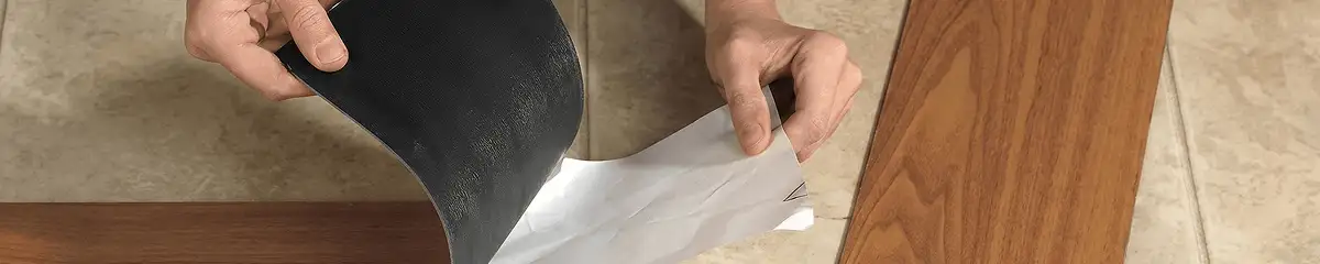 A professional installing vinyl flooring in Bloomington, IN